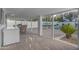 Cozy outdoor patio with dining area, lush landscaping, and a view of the sparkling pool area at 908 E State Ave, Phoenix, AZ 85020