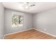 Cozy bedroom filled with natural light from the window overlooking a sunny outdoor space at 10115 W Turney Ave, Phoenix, AZ 85037