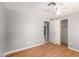 Cozy bedroom featuring a ceiling fan, hardwood floors, and closet at 10115 W Turney Ave, Phoenix, AZ 85037