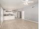 Open floor plan view of kitchen with white cabinets, granite counters, and appliances at 10115 W Turney Ave, Phoenix, AZ 85037