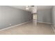 An open living room offers tile floors and light grey walls at 10115 W Turney Ave, Phoenix, AZ 85037