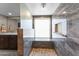 Beautifully updated shower features pebble flooring, marble-like tile and convenient grab bar at 10410 W Royal Palm Rd --, Peoria, AZ 85345