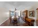 The dining room features hardwood floors, a ceiling fan, and a china cabinet at 10410 W Royal Palm Rd --, Peoria, AZ 85345
