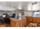 Kitchen island featuring granite countertop with view of living room and backyard at 10410 W Royal Palm Rd --, Peoria, AZ 85345