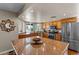 Beautiful kitchen with a view, a large island with marble countertops and stainless steel appliances at 10410 W Royal Palm Rd --, Peoria, AZ 85345