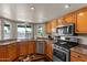 Kitchen showcasing stainless steel appliances, granite countertops, and backyard view at 10410 W Royal Palm Rd --, Peoria, AZ 85345