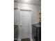 A compact laundry room with a white door and gray appliances is shown at 10410 W Royal Palm Rd --, Peoria, AZ 85345