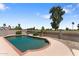 The swimming pool has a light brick trim, manicured landscaping and a large shade tree at 10410 W Royal Palm Rd --, Peoria, AZ 85345