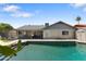 The private pool has brick trim and is adjacent to the back of the house at 10410 W Royal Palm Rd --, Peoria, AZ 85345