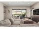 Spacious living room featuring a large sectional sofa and access to the outdoor patio at 10713 N 124Th Pl, Scottsdale, AZ 85259