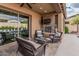 Enjoy outdoor living space with a fireplace, TV, and comfortable seating at 10713 N 124Th Pl, Scottsdale, AZ 85259
