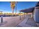 This backyard offers ample space, a covered patio, and is accented by desert landscaping including a large cactus at 11014 W Cocopah St, Avondale, AZ 85323