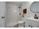 This bathroom features a tiled shower and a modern vanity with elegant fixtures at 11014 W Cocopah St, Avondale, AZ 85323