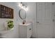 This bathroom features a sleek vanity with dark hardware and stylish decor at 11014 W Cocopah St, Avondale, AZ 85323