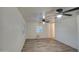 The bedroom features wood floors, white walls, and a ceiling fan for added comfort at 11014 W Cocopah St, Avondale, AZ 85323