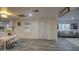 The dining area features a white table, modern chairs, and flows into the living room at 11014 W Cocopah St, Avondale, AZ 85323