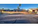 Street view of a gray single-story home with a new horizontal wood slat fence at 11014 W Cocopah St, Avondale, AZ 85323