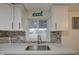 Close up of the stainless sink and faucet in the updated kitchen at 11014 W Cocopah St, Avondale, AZ 85323