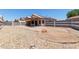 Backyard featuring rock ground cover and a covered patio and well maintained block fencing at 1102 N 5Th St, Buckeye, AZ 85326
