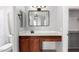 Bathroom featuring vanity with an elevated sink and wood cabinets, mirror, and toilet at 1102 N 5Th St, Buckeye, AZ 85326