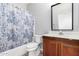 Bathroom featuring a shower and tub combination, toilet, and vanity with cabinets at 1102 N 5Th St, Buckeye, AZ 85326