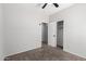 Bedroom with carpet, ceiling fan, and access to an adjoining bathroom and closet at 1102 N 5Th St, Buckeye, AZ 85326