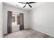 Bedroom offering plush carpeting, neutral walls, and sliding door access to the patio at 1102 N 5Th St, Buckeye, AZ 85326