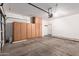 Garage featuring built-in storage and a garage door opener at 1102 N 5Th St, Buckeye, AZ 85326