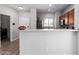 Kitchen area featuring a breakfast bar, stainless steel appliances, wood cabinets, and plenty of countertop space at 1102 N 5Th St, Buckeye, AZ 85326