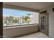 Balcony view of the community pool and landscaped grounds, with residential units at 11375 E Sahuaro Dr # 2033, Scottsdale, AZ 85259