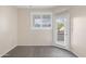 Bright bedroom with carpet, a window with white shutters and access to a balcony at 11375 E Sahuaro Dr # 2033, Scottsdale, AZ 85259
