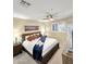 Bright bedroom with modern ceiling fan, mountain art, and luxurious king-size bed at 11375 E Sahuaro Dr # 2033, Scottsdale, AZ 85259