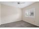 Neutral bedroom with a ceiling fan, plush carpeting and window with views at 11375 E Sahuaro Dr # 2033, Scottsdale, AZ 85259