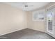 Neutral bedroom with a ceiling fan, plush carpeting and access to balcony at 11375 E Sahuaro Dr # 2033, Scottsdale, AZ 85259