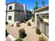 A ground level exterior of the apartment featuring desert landscaping and clear blue skies at 11375 E Sahuaro Dr # 2033, Scottsdale, AZ 85259