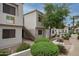 Building exterior shows the building number, desert landscaping, and stairwell at 11375 E Sahuaro Dr # 2033, Scottsdale, AZ 85259