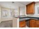 Kitchen featuring stainless steel appliances, granite countertops, and wood cabinetry at 11375 E Sahuaro Dr # 2033, Scottsdale, AZ 85259