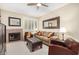 Cozy living room with a fireplace, comfortable sofa, and stylish decor at 11375 E Sahuaro Dr # 2033, Scottsdale, AZ 85259
