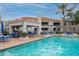 Well-maintained community pool with grilling area and comfortable seating options for residents at 11375 E Sahuaro Dr # 2033, Scottsdale, AZ 85259