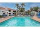 Inviting swimming pool with comfortable lounge chairs and lush greenery surrounding the area at 11375 E Sahuaro Dr # 2033, Scottsdale, AZ 85259