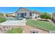 Landscaped backyard featuring a sparkling pool, patio, and well-maintained lawn at 11580 N 86Th Ln, Peoria, AZ 85345