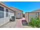 Spacious backyard with a shed, air conditioning unit, and brick pathway, perfect for outdoor enjoyment at 11580 N 86Th Ln, Peoria, AZ 85345