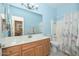 Bathroom includes vanity with double sinks, a large mirror, and a shower-tub combination at 11580 N 86Th Ln, Peoria, AZ 85345