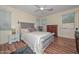 Relaxing bedroom features natural light, a decorative ceiling fan, and classic wood furnishings at 11580 N 86Th Ln, Peoria, AZ 85345
