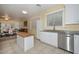 Bright kitchen with island and stainless steel appliances adjoins dining room for easy living and entertaining at 11580 N 86Th Ln, Peoria, AZ 85345