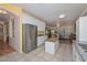 Bright, open kitchen flowing to the dining room with stainless steel appliances and ample countertop space at 11580 N 86Th Ln, Peoria, AZ 85345