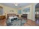 Comfortable living room showcasing hardwood floors, bright lighting, and a welcoming ambiance at 11580 N 86Th Ln, Peoria, AZ 85345