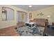 Warm living room with hardwood flooring and an open layout ideal for gatherings and everyday living at 11580 N 86Th Ln, Peoria, AZ 85345
