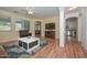 Cozy living room features hardwood floors, abundant natural light, and an open floor plan at 11580 N 86Th Ln, Peoria, AZ 85345