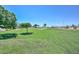 Expansive green park with mature trees, providing a serene and open space for recreation at 11580 N 86Th Ln, Peoria, AZ 85345